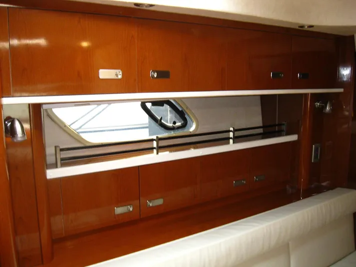  Yacht Photos Pics Interior of 2011 Sea Ray 350 Sundancer with wooden cabinetry and window.