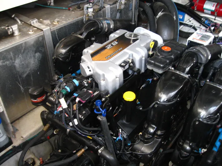  Yacht Photos Pics Engine compartment of a 2011 Sea Ray 350 Sundancer boat, showcasing detailed mechanical components.