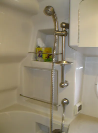 Yacht Photos Pics Shower area in 2011 Sea Ray 350 Sundancer yacht, featuring modern fixtures and storage shelves.