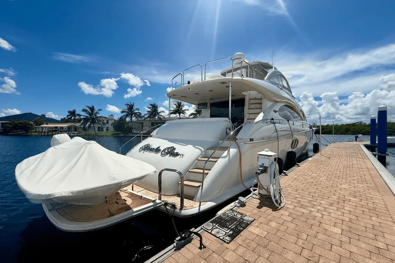 Marsha Sea Yacht Photos Pics Luxury 2005 Lazzara 68 Flybridge yacht docked under clear blue sky.