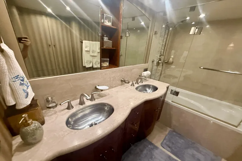 Marsha Sea Yacht Photos Pics Luxurious bathroom in 2005 Lazzara 68 Flybridge yacht with dual sinks and elegant fixtures.