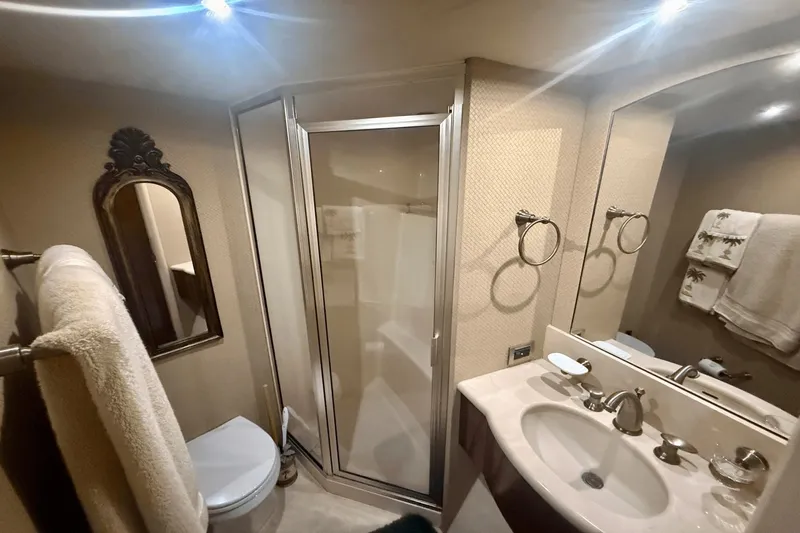 Marsha Sea Yacht Photos Pics Luxurious bathroom in 2005 Lazzara 68 Flybridge yacht with shower and elegant fixtures.
