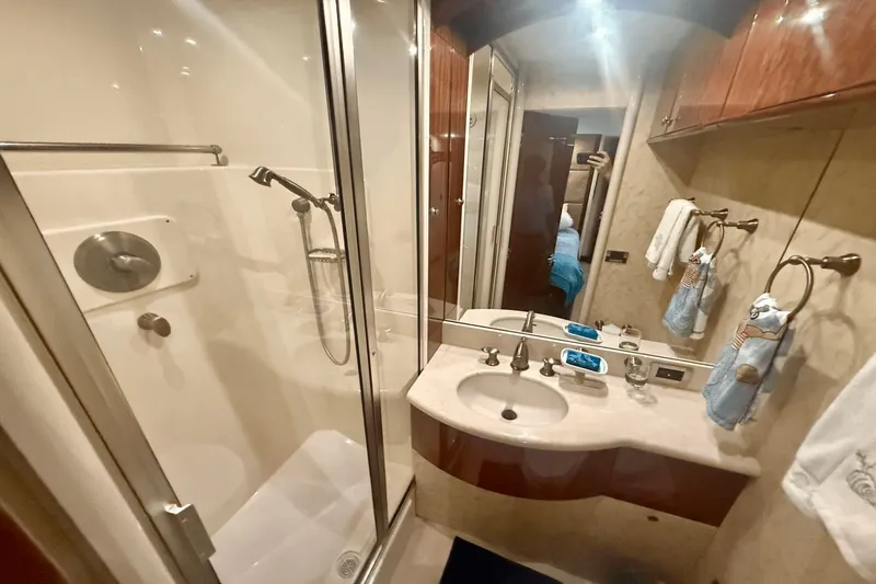 Marsha Sea Yacht Photos Pics Bathroom interior of 2005 Lazzara 68 Flybridge yacht with shower and sink.