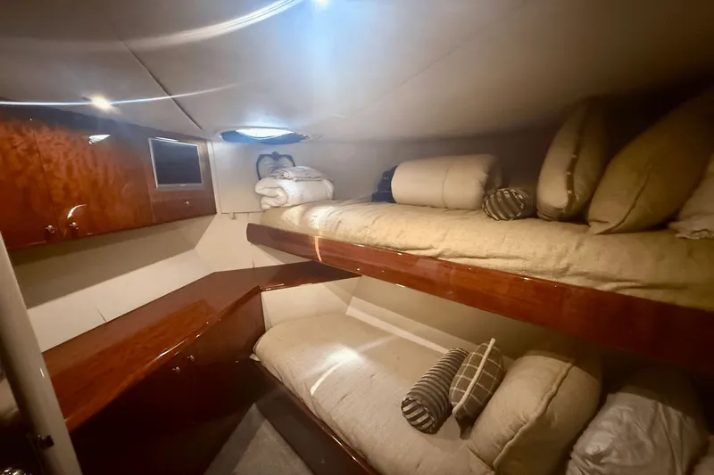 Marsha Sea Yacht Photos Pics Luxurious 2005 Lazzara 68 Flybridge yacht cabin with cozy bunk beds and elegant wood finish.