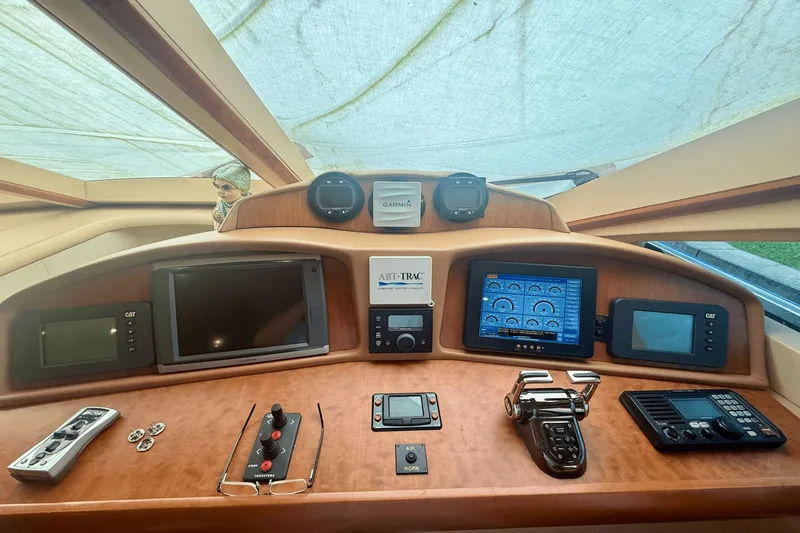 Marsha Sea Yacht Photos Pics Control panel of 2005 Lazzara 68 Flybridge yacht with navigation and communication equipment.