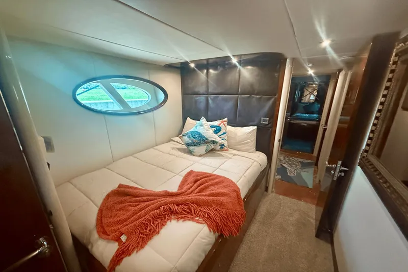 Marsha Sea Yacht Photos Pics Luxurious bedroom interior of 2005 Lazzara 68 Flybridge yacht with cozy bedding.