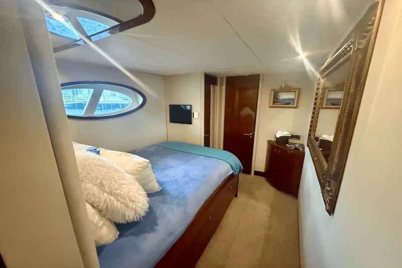 Marsha Sea Yacht Photos Pics Luxurious bedroom interior of 2005 Lazzara 68 Flybridge yacht with elegant decor.