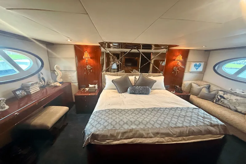 Marsha Sea Yacht Photos Pics Luxurious bedroom interior of 2005 Lazzara 68 Flybridge yacht with elegant decor and furnishings.