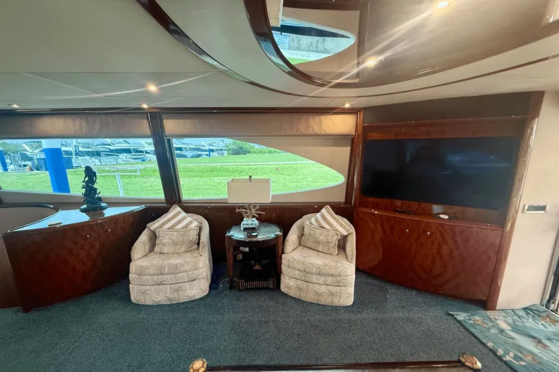 Marsha Sea Yacht Photos Pics Luxurious interior of 2005 Lazzara 68 Flybridge yacht with elegant seating and large windows.