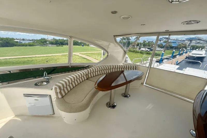 Marsha Sea Yacht Photos Pics 2005 Lazzara 68 Flybridge yacht interior with seating, table, and sink.