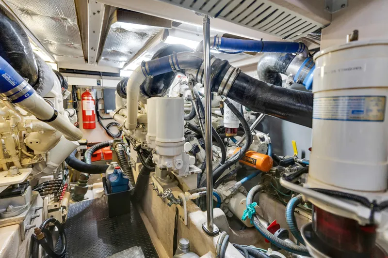  Yacht Photos Pics Engine room of 2006 Sea Ray 58 Sedan Bridge, showcasing complex machinery and components.