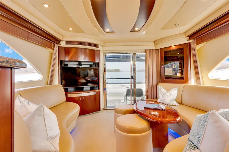  Yacht Photos Pics Luxurious interior of 2006 Sea Ray 58 Sedan Bridge yacht with elegant seating and modern amenities.