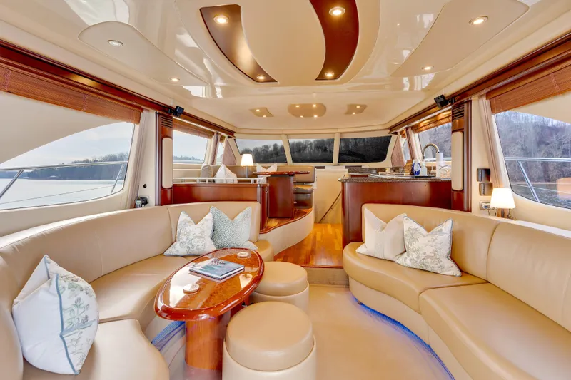  Yacht Photos Pics Luxurious interior of 2006 Sea Ray 58 Sedan Bridge yacht with elegant seating and decor.
