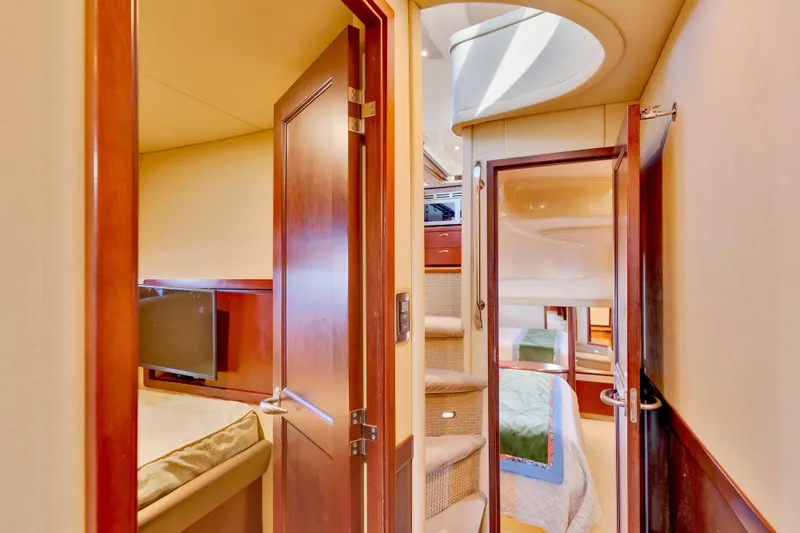  Yacht Photos Pics Interior of 2006 Sea Ray 58 Sedan Bridge yacht, featuring cozy cabins and elegant wood finishes.