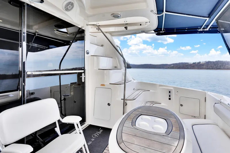  Yacht Photos Pics 2006 Sea Ray 58 Sedan Bridge yacht interior with seating, table, and scenic water view.