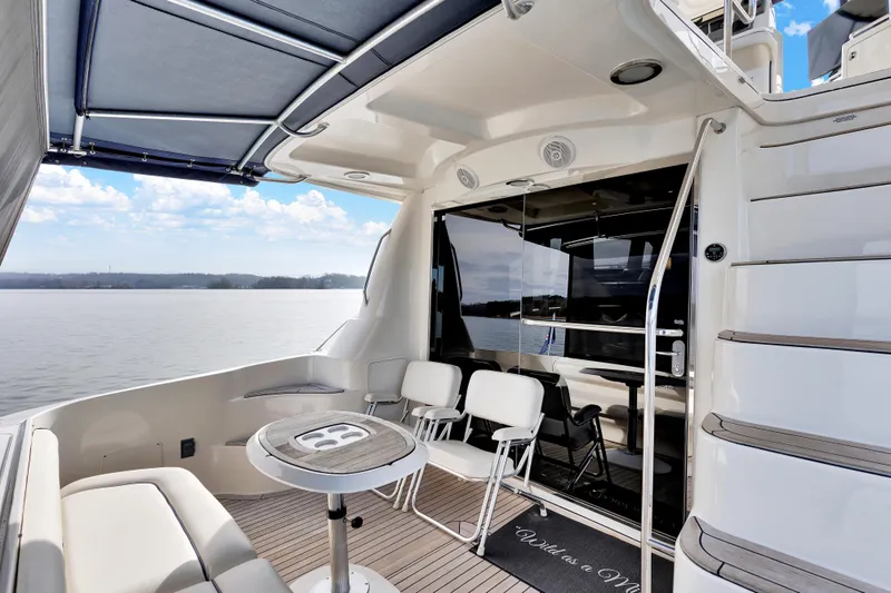  Yacht Photos Pics 2006 Sea Ray 58 Sedan Bridge yacht deck with seating and scenic water view.
