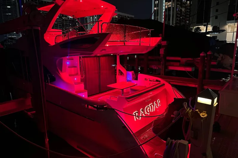  Yacht Photos Pics 2013 Azimut Fly 53 yacht illuminated with vibrant red lights at night.