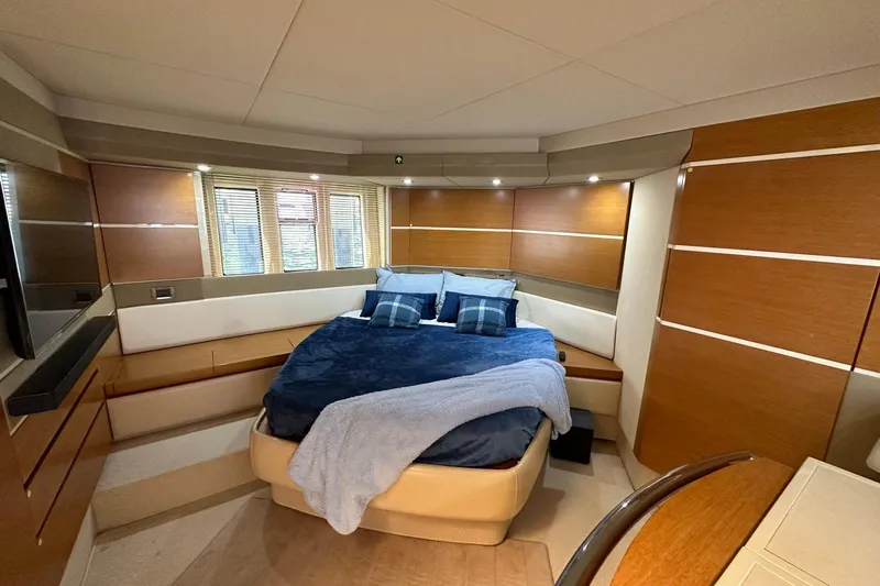  Yacht Photos Pics Luxurious bedroom interior of 2013 Azimut Fly 53 yacht with modern design and cozy bedding.
