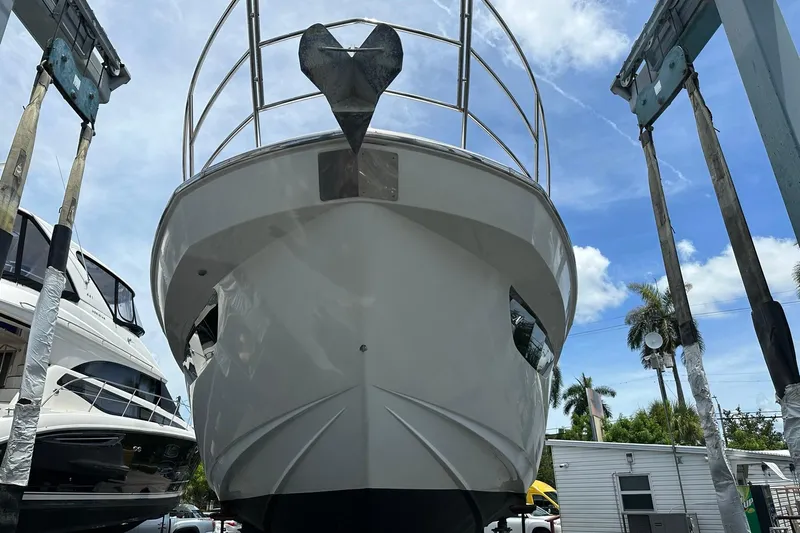  Yacht Photos Pics Azimut Fly 53 yacht from 2013 on a lift, under a clear blue sky.