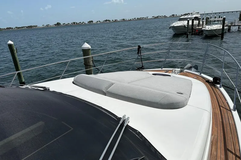  Yacht Photos Pics Azimut Fly 53 yacht, 2013 model, docked with sunbed on deck, scenic water view.