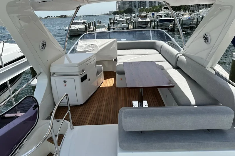  Yacht Photos Pics Luxurious 2013 Azimut Fly 53 yacht interior with elegant seating and wooden flooring.