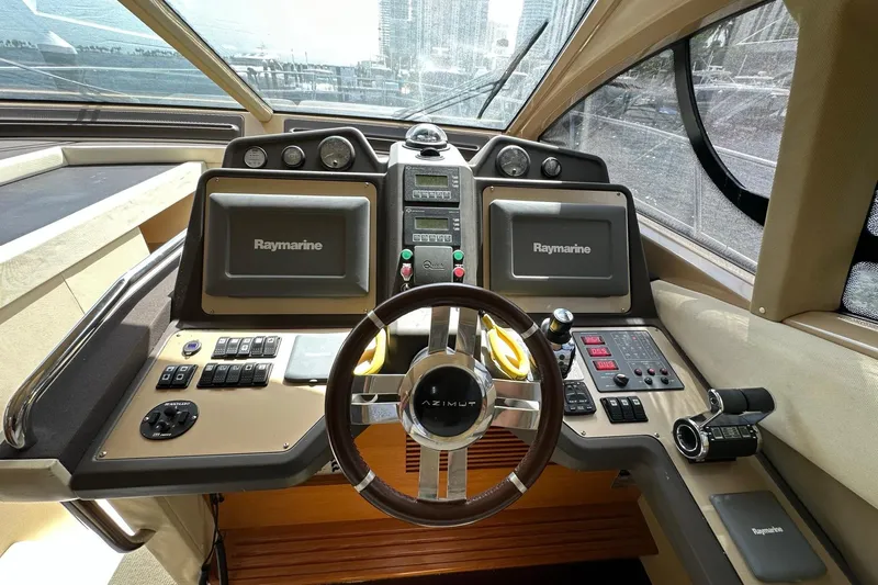  Yacht Photos Pics Cockpit of 2013 Azimut Fly 53 yacht with Raymarine navigation systems and modern controls.