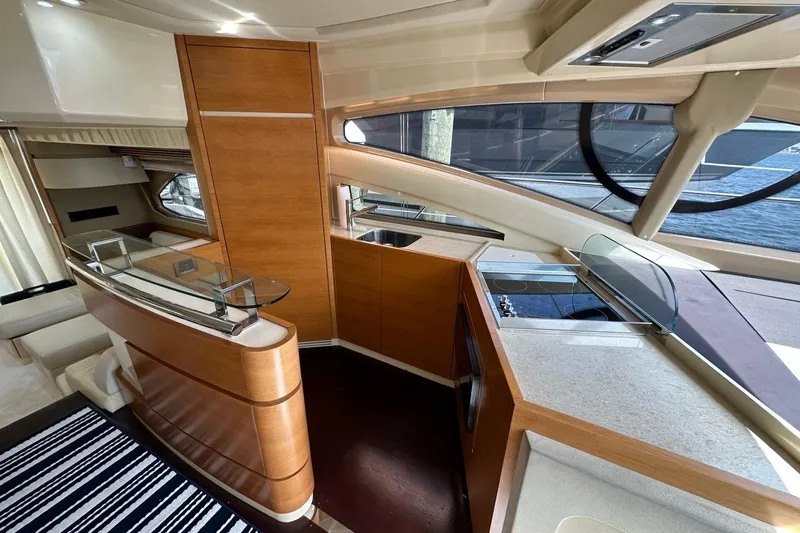  Yacht Photos Pics Luxurious interior of 2013 Azimut Fly 53 yacht with modern kitchen and elegant wood finishes.