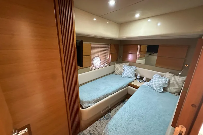  Yacht Photos Pics Luxurious twin cabin interior of 2013 Azimut Fly 53 yacht with cozy bedding.