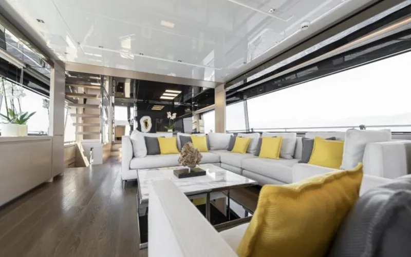  Yacht Photos Pics Luxurious interior of 2018 Sanlorenzo SL86 yacht with modern decor and yellow accents.
