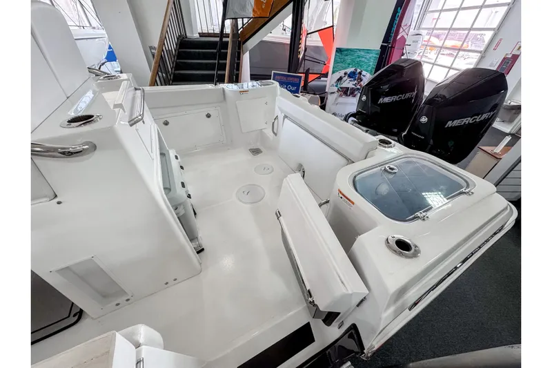  Yacht Photos Pics 2024 Wellcraft 263 Fisherman boat interior with dual Mercury engines, spacious deck, and seating.