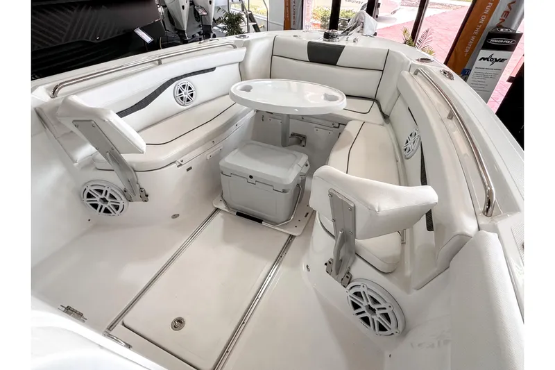  Yacht Photos Pics 2024 Wellcraft 263 Fisherman boat interior with seating, table, and speakers.