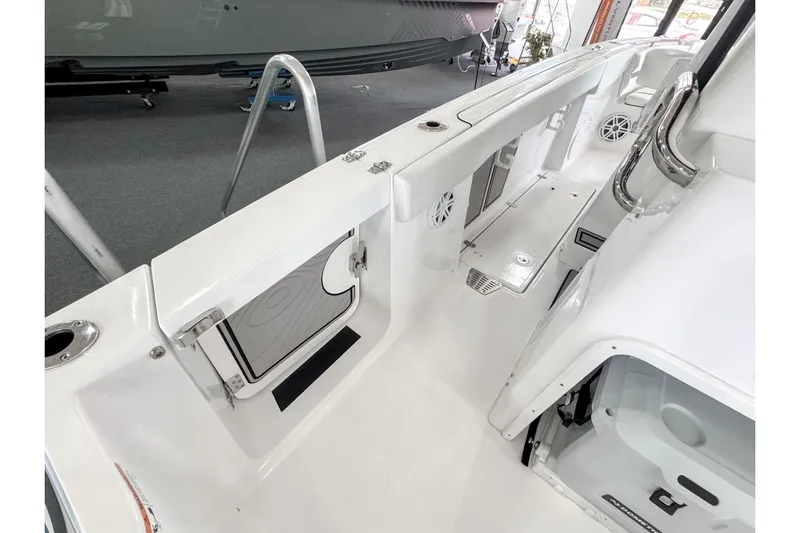  Yacht Photos Pics 2024 Wellcraft 263 Fisherman boat interior, featuring sleek white design and modern amenities.