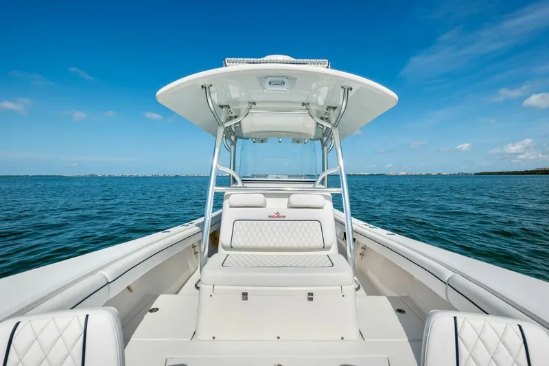  Yacht Photos Pics 2012 Regulator 32 FS boat on open water under clear blue sky.