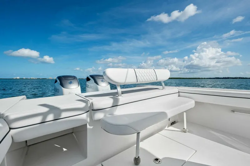  Yacht Photos Pics 2012 Regulator 32 FS boat with Suzuki engines on a sunny day at sea.