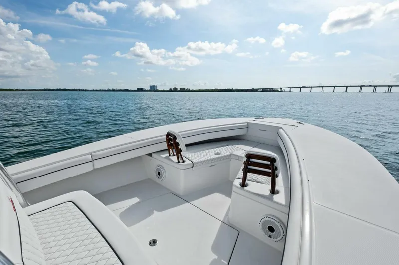  Yacht Photos Pics 2012 Regulator 32 FS boat on calm water with bridge in background.