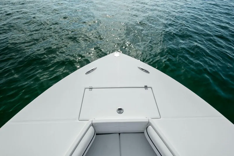  Yacht Photos Pics Bow of 2012 Regulator 32 FS boat on calm water.