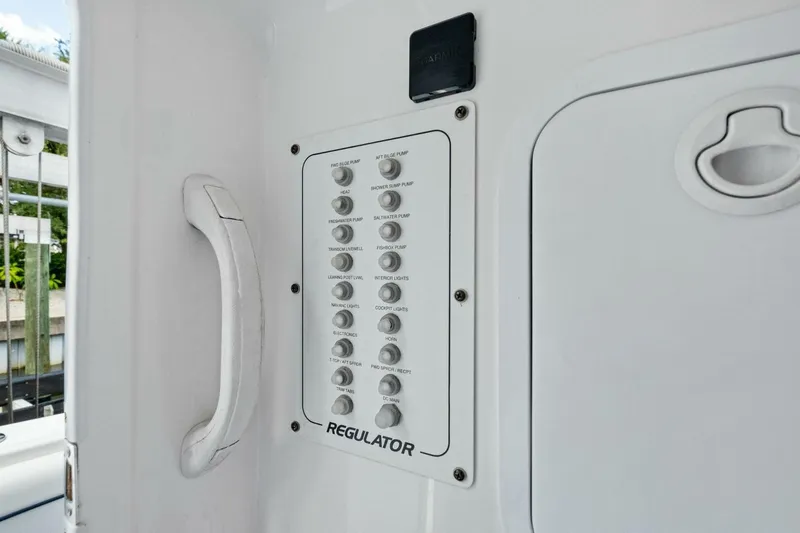  Yacht Photos Pics Control panel on a 2012 Regulator 32 FS boat, featuring various switches.