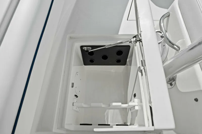 Yacht Photos Pics Open storage compartment on a 2012 Regulator 32 FS boat, featuring a hydraulic lift.