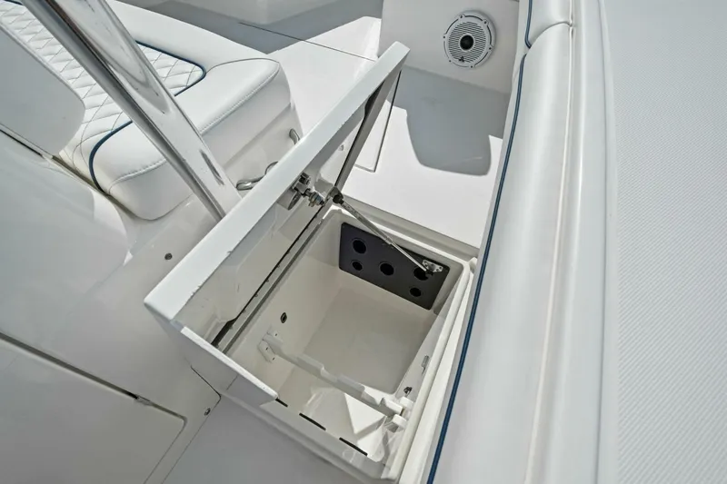  Yacht Photos Pics Open storage compartment on 2012 Regulator 32 FS boat, featuring white interior and seating.