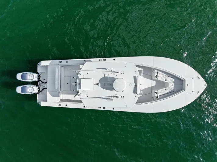  Yacht Photos Pics Overhead view of a 2012 Regulator 32 FS boat on green water.