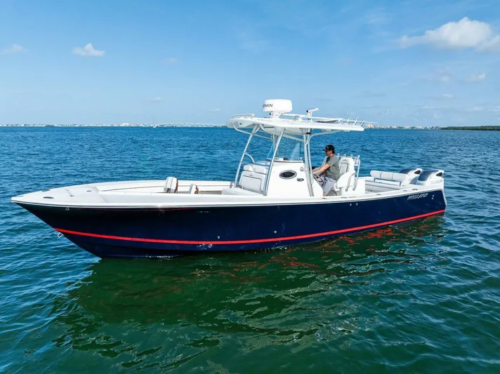  Yacht Photos Pics 2012 Regulator 32 FS boat on calm blue water under clear sky.