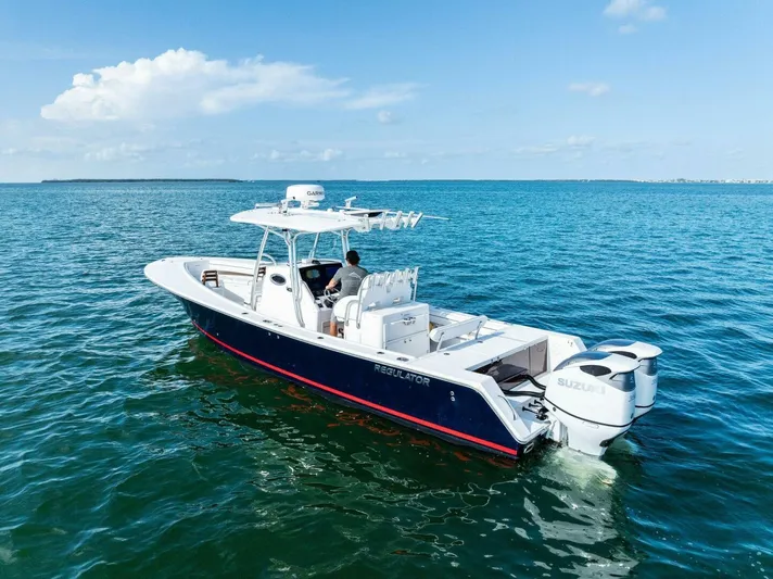  Yacht Photos Pics 2012 Regulator 32 FS boat on open water, featuring dual Suzuki engines.