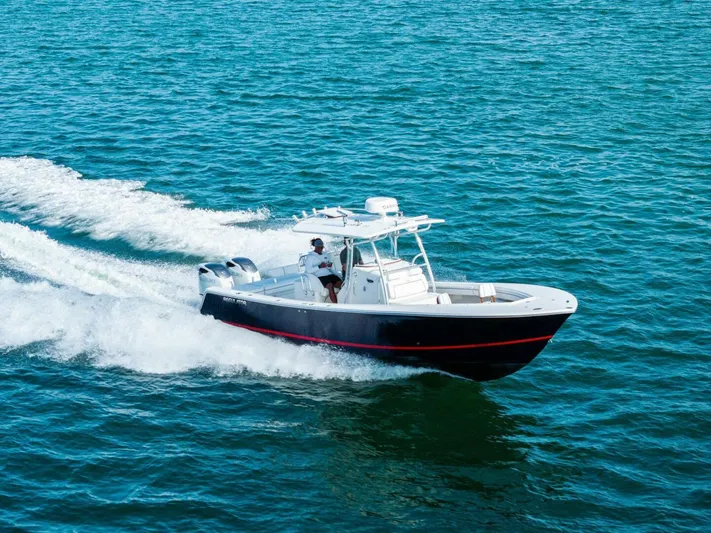  Yacht Photos Pics 2012 Regulator 32 FS boat cruising on open water.