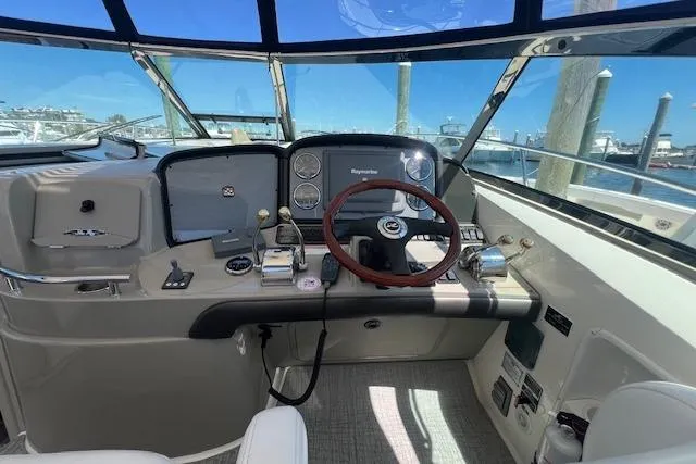 Irish Exit Yacht Photos Pics Helm of 2007 Sea Ray 38 Sundancer with wooden steering wheel and navigation equipment.