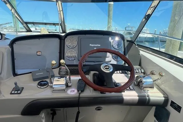 Irish Exit Yacht Photos Pics Helm of 2007 Sea Ray 38 Sundancer with Raymarine electronics and wooden steering wheel.