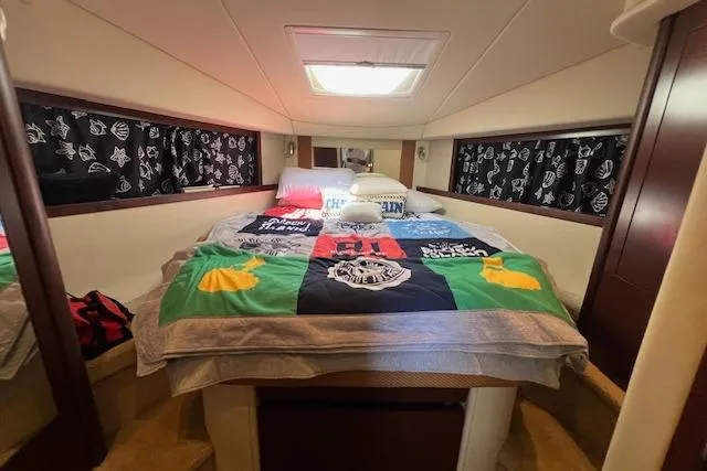 Irish Exit Yacht Photos Pics Cozy bedroom interior of 2007 Sea Ray 38 Sundancer yacht with colorful bedding.