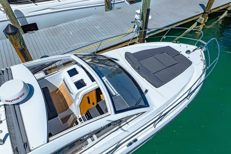  Yacht Photos Pics 2019 Sealine S330V yacht docked, featuring sleek design and spacious sunbathing area.