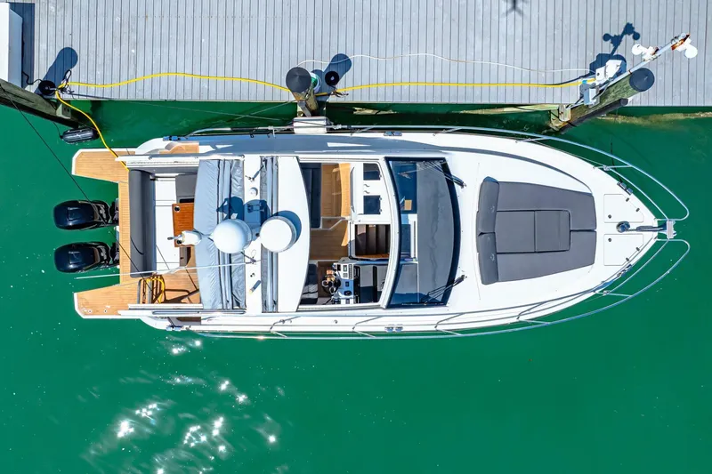  Yacht Photos Pics 2019 Sealine S330V yacht docked, aerial view, turquoise water, sleek design.