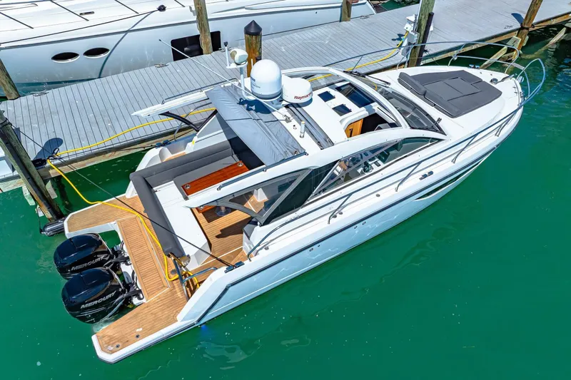  Yacht Photos Pics 2019 Sealine S330V yacht docked, featuring sleek design and dual outboard engines.