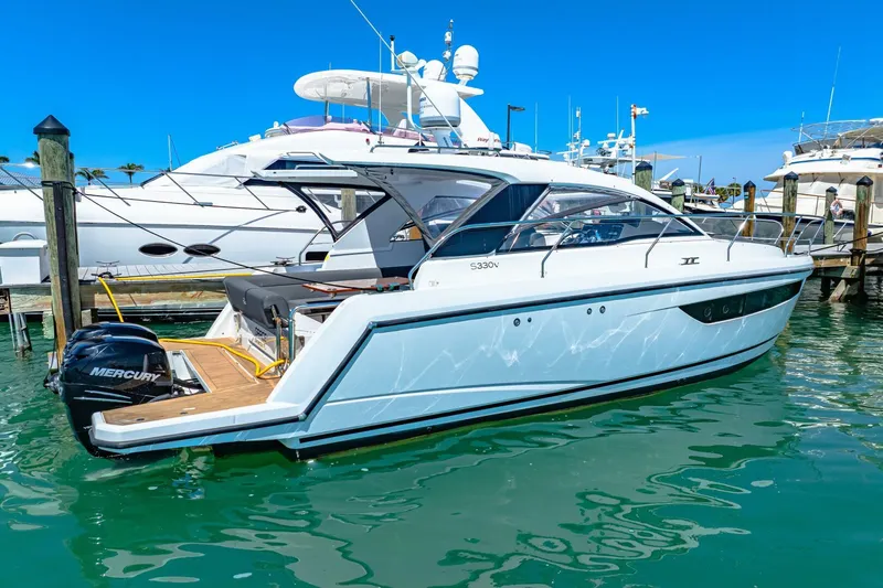  Yacht Photos Pics 2019 Sealine S330V yacht docked in marina, featuring sleek design and Mercury outboard engine.